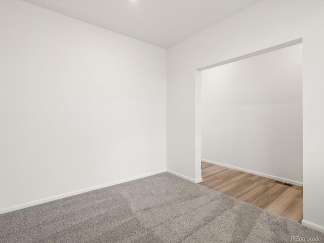 4694 Sugarcane St, Johnstown, CO 80534 - empty room featuring carpet flooring and baseboards