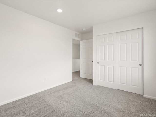 4694 Sugarcane St, Johnstown, CO 80534 - unfurnished bedroom with carpet flooring, a closet, and recessed lighting