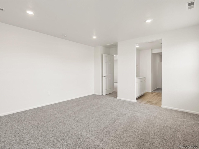 4694 Sugarcane St, Johnstown, CO 80534 - unfurnished bedroom featuring light carpet and recessed lighting