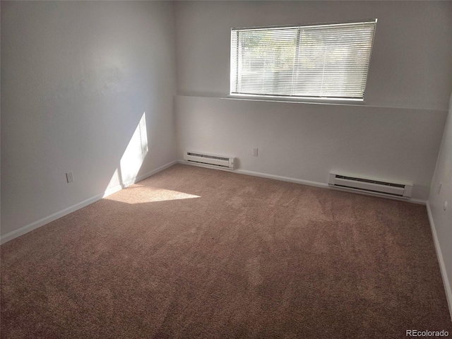 empty room with baseboard heating and carpet flooring