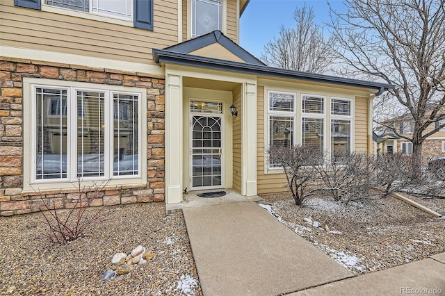 view of exterior entry with stone siding