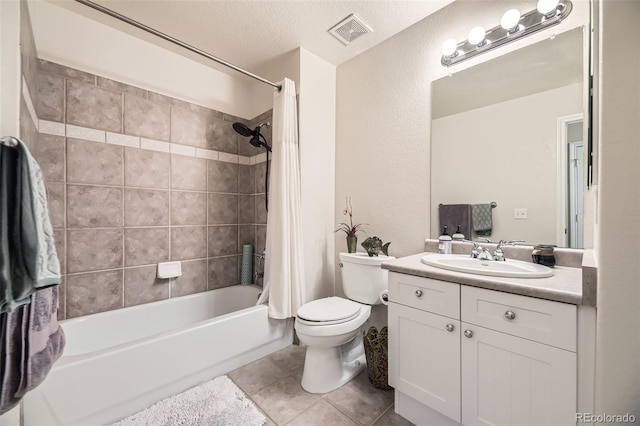 full bath featuring toilet, vanity, visible vents, tile patterned floors, and shower / bath combination with curtain