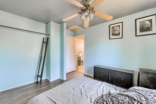 bedroom featuring ceiling fan and wood-type flooring