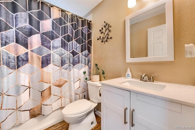 full bathroom featuring vanity, hardwood / wood-style flooring, toilet, and shower / tub combo with curtain