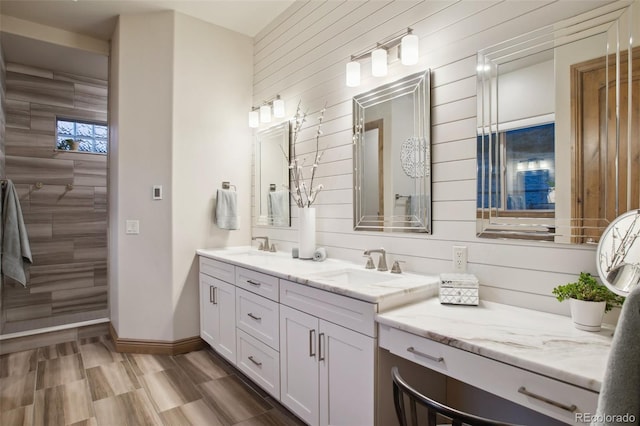 bathroom featuring a shower, wood-type flooring, and vanity