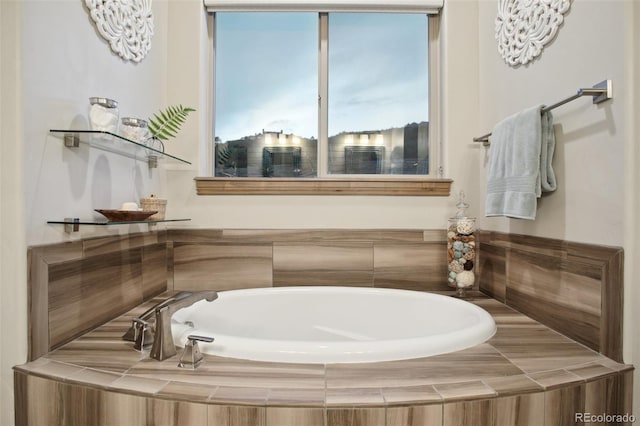 bathroom with a relaxing tiled tub