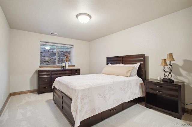 bedroom featuring light carpet