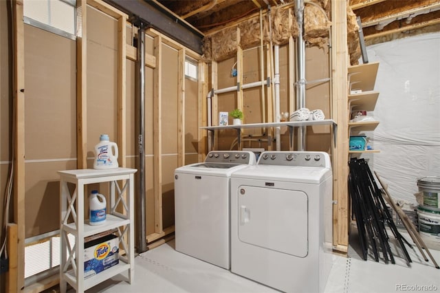 clothes washing area with washer and dryer