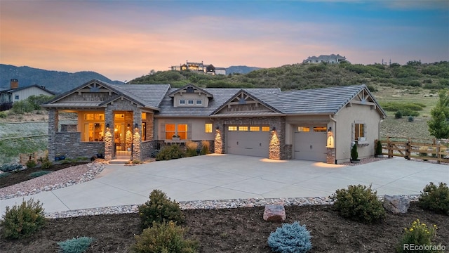 craftsman-style house featuring a mountain view and a garage