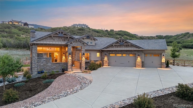 craftsman-style home with a garage