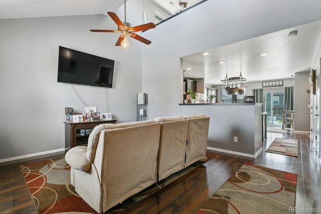 9919 Memphis St, Commerce City, CO 80022 - living area featuring wood finished floors, a ceiling fan, baseboards, recessed lighting, and high vaulted ceiling