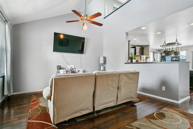 9919 Memphis St, Commerce City, CO 80022 - living room featuring a ceiling fan, wood finished floors, baseboards, lofted ceiling, and recessed lighting