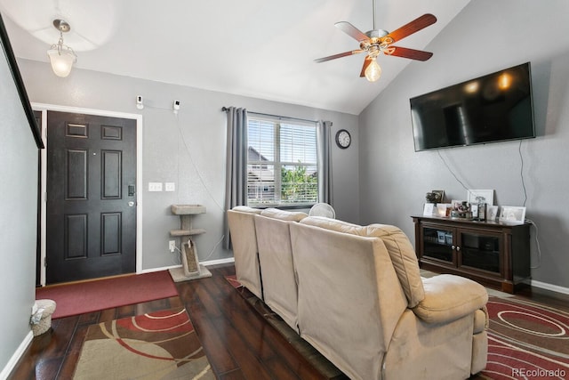 9919 Memphis St, Commerce City, CO 80022 - living room featuring wood finished floors, vaulted ceiling, baseboards, and a ceiling fan