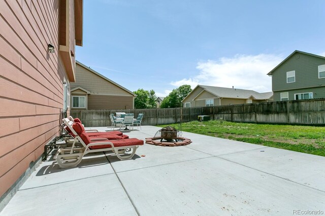 9919 Memphis St, Commerce City, CO 80022 - view of patio / terrace featuring a fire pit
