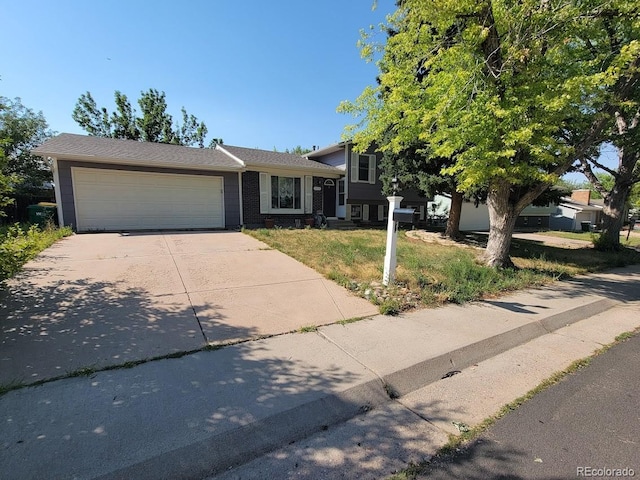 view of front facade with a garage and a front yard