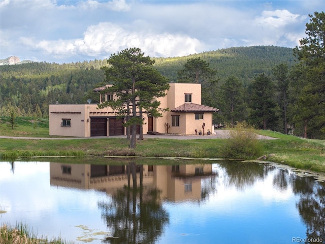 28098 Green Valley Ln, Conifer, CO 80433 - water view with a forest