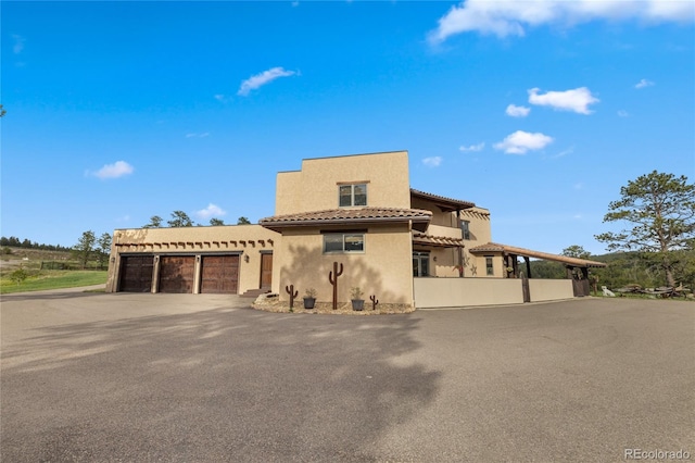 28098 Green Valley Ln, Conifer, CO 80433 - mediterranean / spanish-style home with stucco siding and a tiled roof