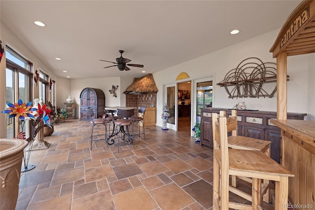 28098 Green Valley Ln, Conifer, CO 80433 - dining area featuring plenty of natural light, a ceiling fan, dark stone finish floors, and recessed lighting