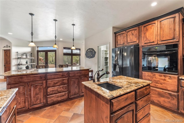 28098 Green Valley Ln, Conifer, CO 80433 - kitchen featuring black appliances, a center island with sink, a sink, hanging light fixtures, and recessed lighting