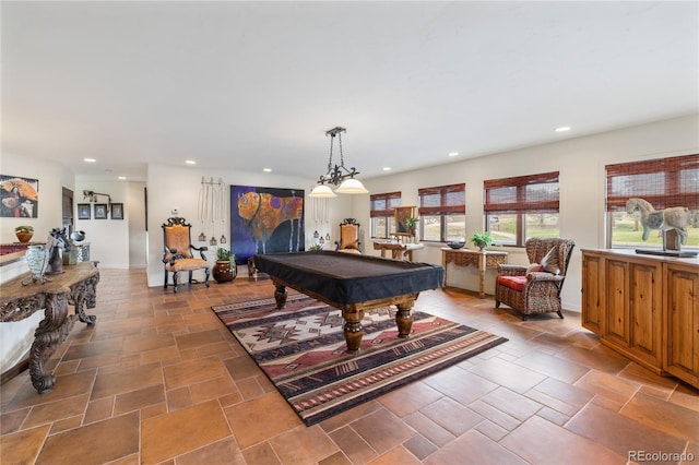 28098 Green Valley Ln, Conifer, CO 80433 - playroom featuring pool table, plenty of natural light, recessed lighting, and light stone finish floors