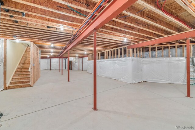 28098 Green Valley Ln, Conifer, CO 80433 - unfinished below grade area featuring stairs