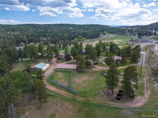28098 Green Valley Ln, Conifer, CO 80433 - aerial overview of property's location featuring a heavily wooded area and a mountainous background