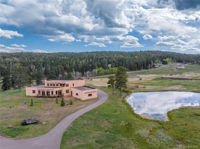 28098 Green Valley Ln, Conifer, CO 80433 - aerial view of property and surrounding area featuring a heavily wooded area and a nearby body of water