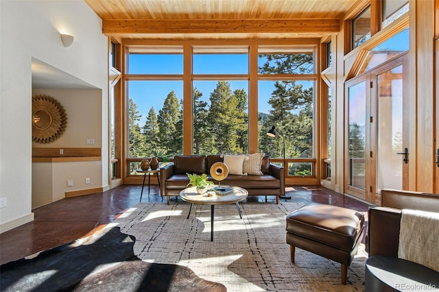 9041 Eastridge Rd, Golden, CO 80403 - sunroom with healthy amount of natural light and beam ceiling