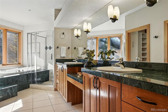 9041 Eastridge Rd, Golden, CO 80403 - bathroom with a stall shower, vanity, a garden tub, and tile patterned flooring