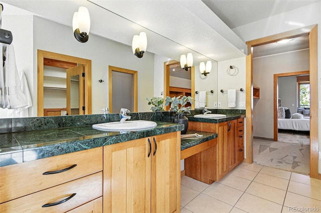 9041 Eastridge Rd, Golden, CO 80403 - bathroom with ensuite bath, tile patterned flooring, and double vanity