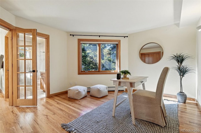 9041 Eastridge Rd, Golden, CO 80403 - office space featuring light wood-style floors, baseboards, a baseboard heating unit, and french doors