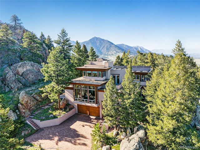 9041 Eastridge Rd, Golden, CO 80403 - back of house featuring stucco siding and a mountain view