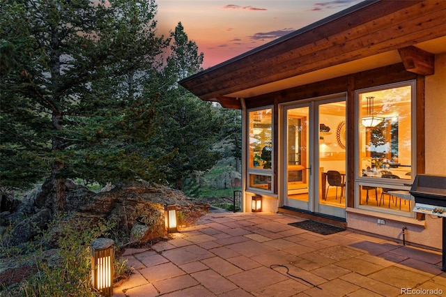 9041 Eastridge Rd, Golden, CO 80403 - patio terrace at dusk with a patio area