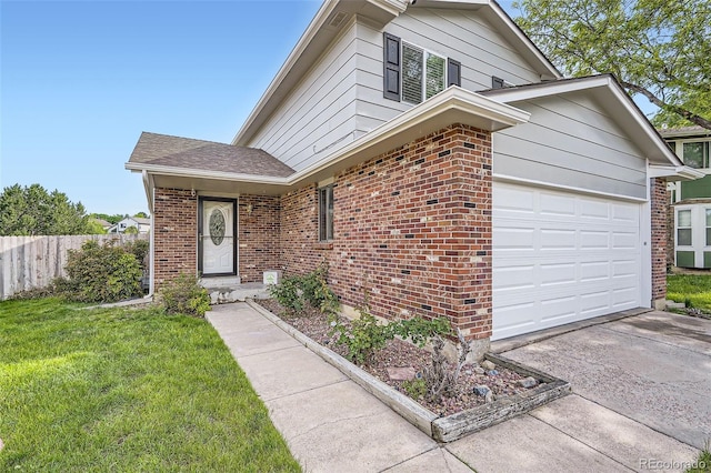 9630 W 104th Ave, Broomfield, CO 80021 - view of front of property featuring driveway, brick siding, and an attached garage