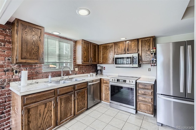 9630 W 104th Ave, Broomfield, CO 80021 - kitchen featuring appliances with stainless steel finishes, light tile patterned floors, light countertops, and recessed lighting