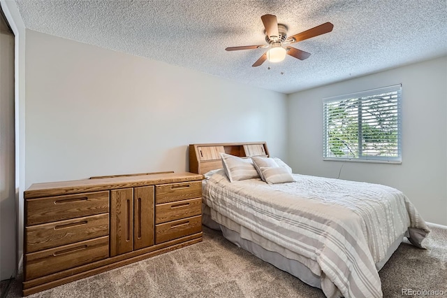 9630 W 104th Ave, Broomfield, CO 80021 - bedroom featuring light colored carpet, a textured ceiling, and a ceiling fan
