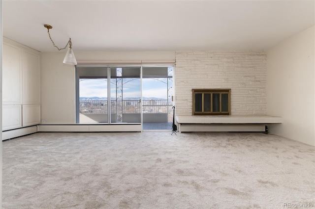 unfurnished living room featuring a fireplace and carpet floors