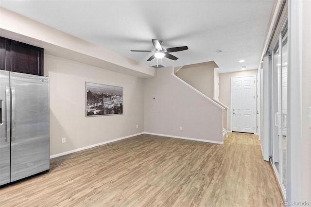 23630 E 5th Pl, Aurora, CO 80018 - unfurnished living room featuring a ceiling fan, light wood-type flooring, stairs, and recessed lighting