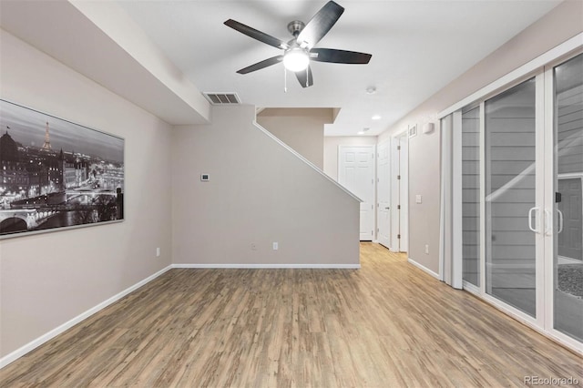 spare room featuring hardwood / wood-style flooring and ceiling fan