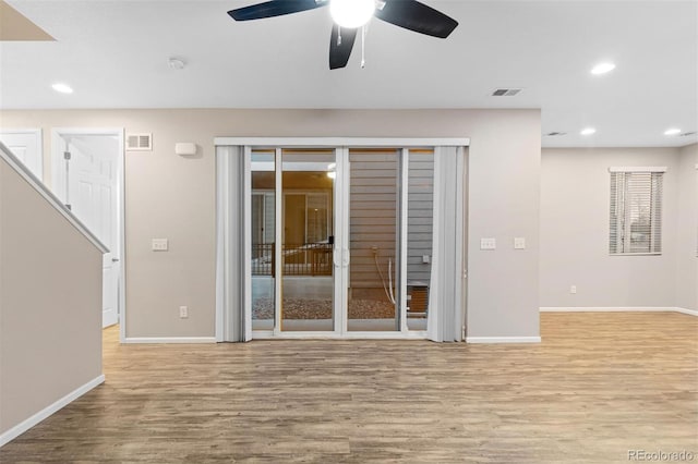 unfurnished living room featuring light hardwood / wood-style floors and ceiling fan