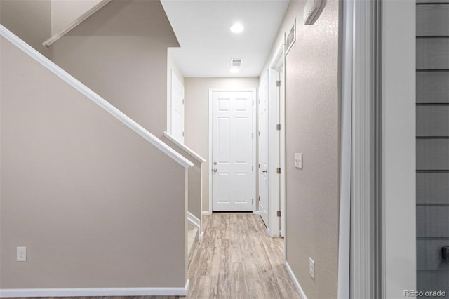 23630 E 5th Pl, Aurora, CO 80018 - hallway featuring light wood finished floors, stairway, and recessed lighting