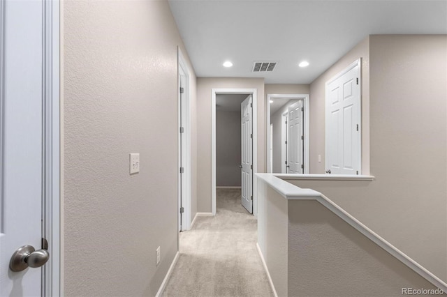 23630 E 5th Pl, Aurora, CO 80018 - hallway with light colored carpet, recessed lighting, and a textured wall