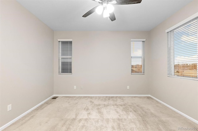 carpeted empty room with ceiling fan