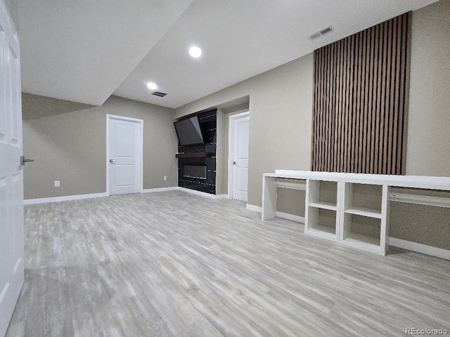 483 W 172nd Pl, Broomfield, CO 80023 - unfurnished living room with wood finished floors, baseboards, a fireplace, and recessed lighting