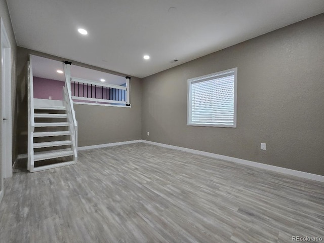 483 W 172nd Pl, Broomfield, CO 80023 - below grade area with wood finished floors, baseboards, recessed lighting, and stairs