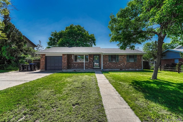 7479 Pierce St, Arvada, CO 80003 - ranch-style home with a garage, concrete driveway, and brick siding