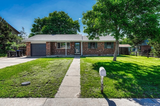 7479 Pierce St, Arvada, CO 80003 - ranch-style house with an attached garage, brick siding, concrete driveway, and roof with shingles