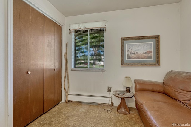7479 Pierce St, Arvada, CO 80003 - living area featuring a baseboard radiator and light flooring