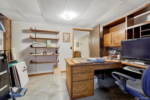 7479 Pierce St, Arvada, CO 80003 - home office with a paneled ceiling and unfinished concrete floors