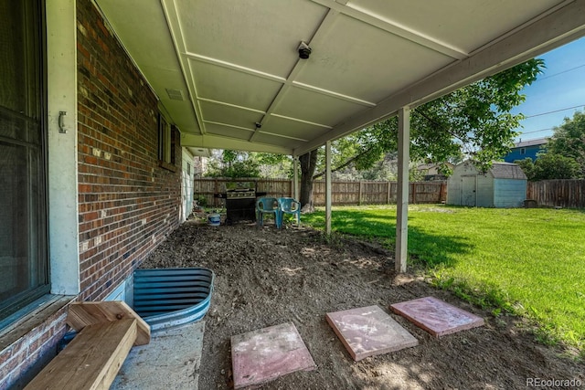 7479 Pierce St, Arvada, CO 80003 - fenced backyard featuring a storage unit